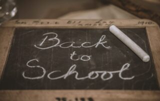 Wooden framed small blackboard with Back to School written on it in chalk