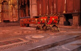 The row of red seats where the royal family sit in Westminster Abbey