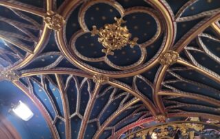 Ornate dark blue and gold carved ceiling at Westminster Abbey