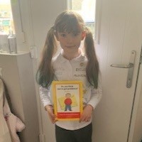 Lilian holding a book about dyslexia