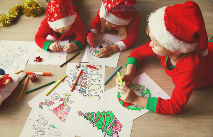 Children colouring Christmas pictures