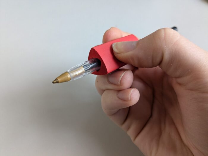 Soft red triangle grip on pen