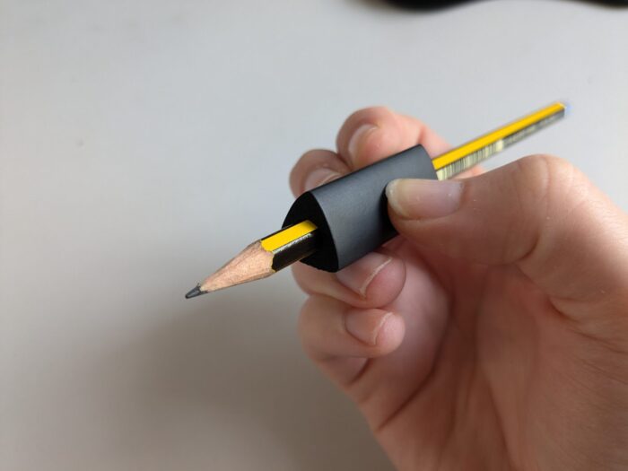 Black soft triangle grip on pencil